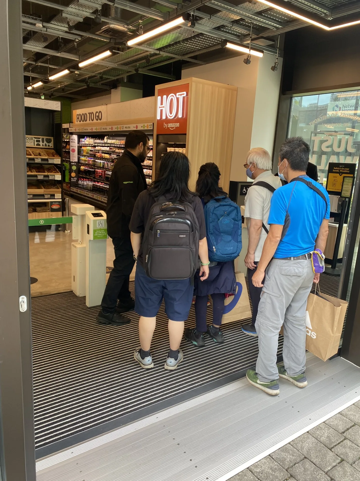Shoppers arriving at an Amazon Fresh store in Wembley with FOTS in-store team support
