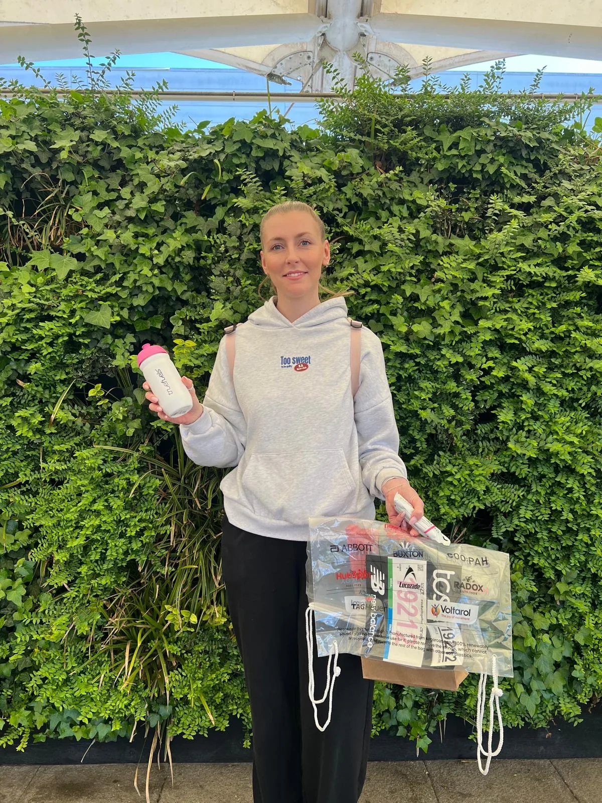 FOTS team member holding a Truefuels bottle and sample bag at the TCS London Marathon expo